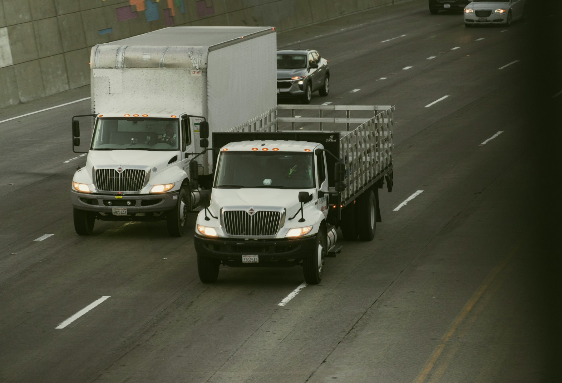 Box trucks driving on a highway